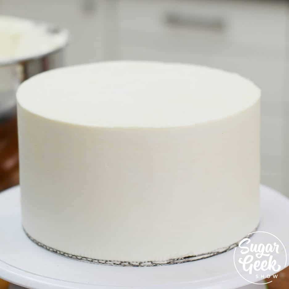 frosted buttercream cake with straight lines and sharp edges