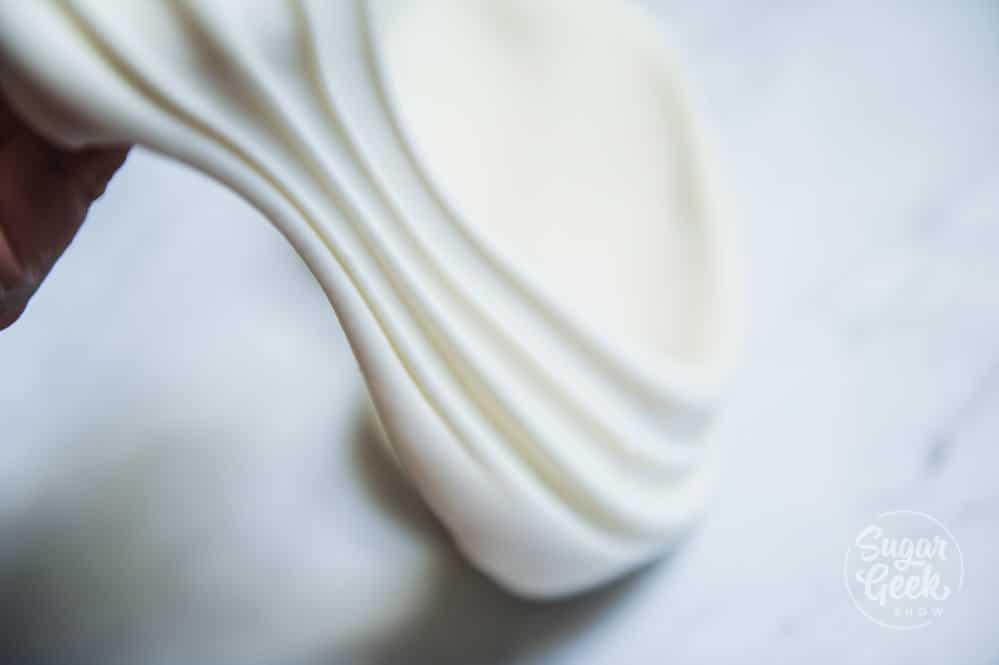 Stretched fondant on a white countertop.