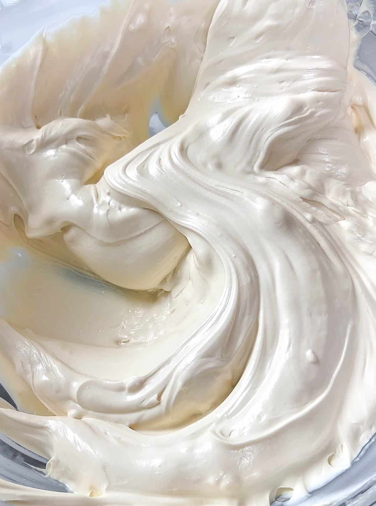 Close up of melted white chocolate in a bowl.