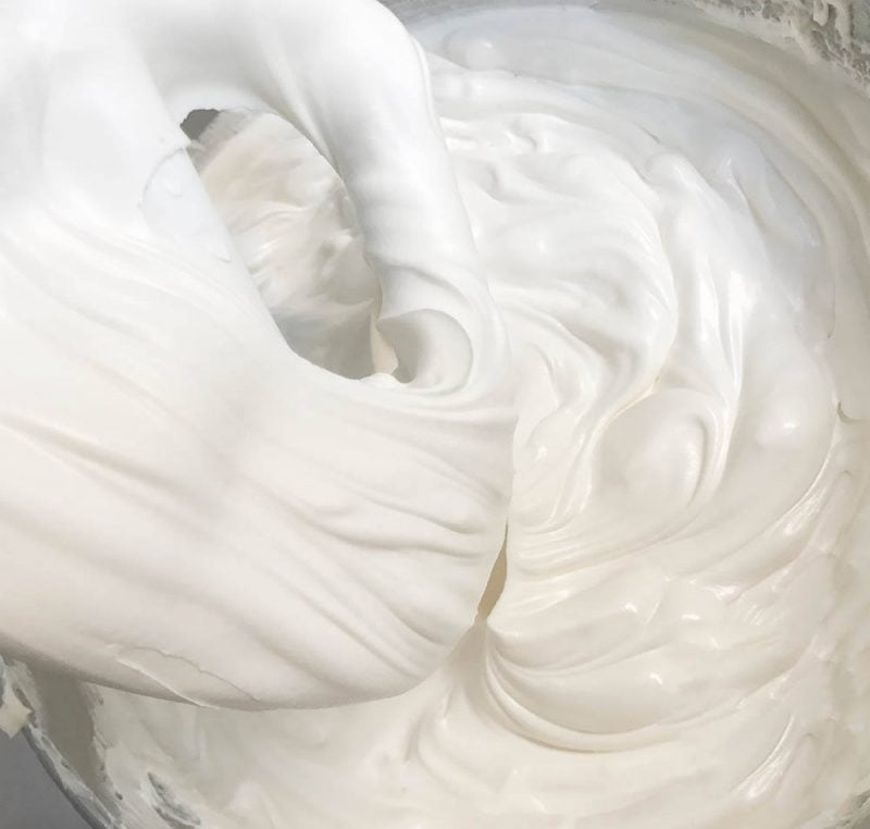 Swiss meringue buttercream is made with egg whites, sugar, vanilla which is heated, whipped into a meringue and then cooled before adding in butter and whipping until light and fluffy. This buttercream is not as sweet as American Buttercream 