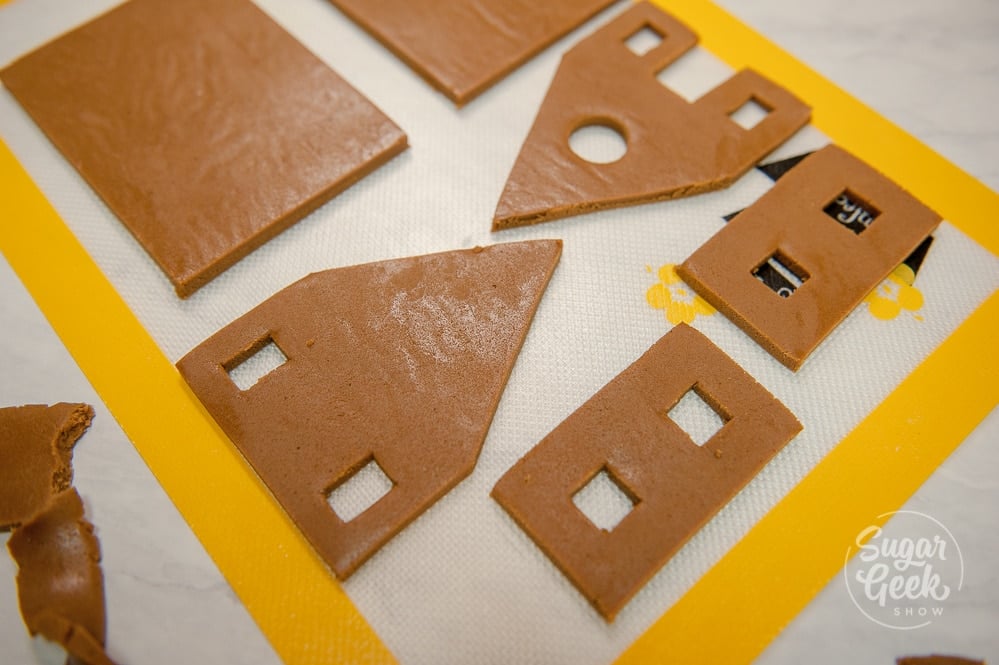gingerbread house dough pieces on a silicone mat