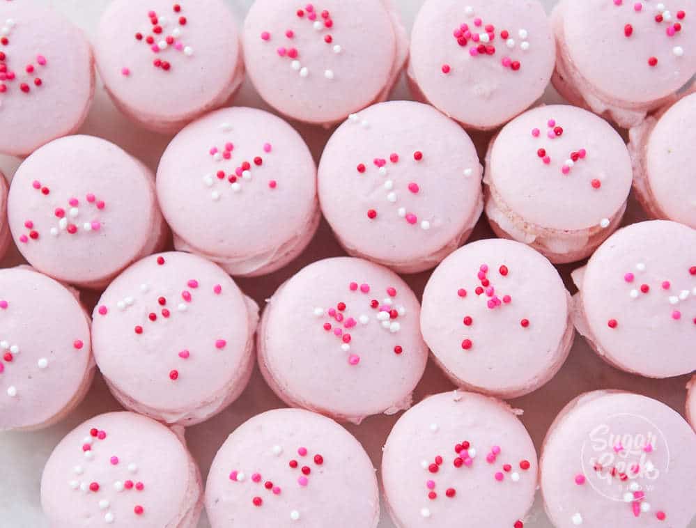 strawberry macarons with sprinkles on top