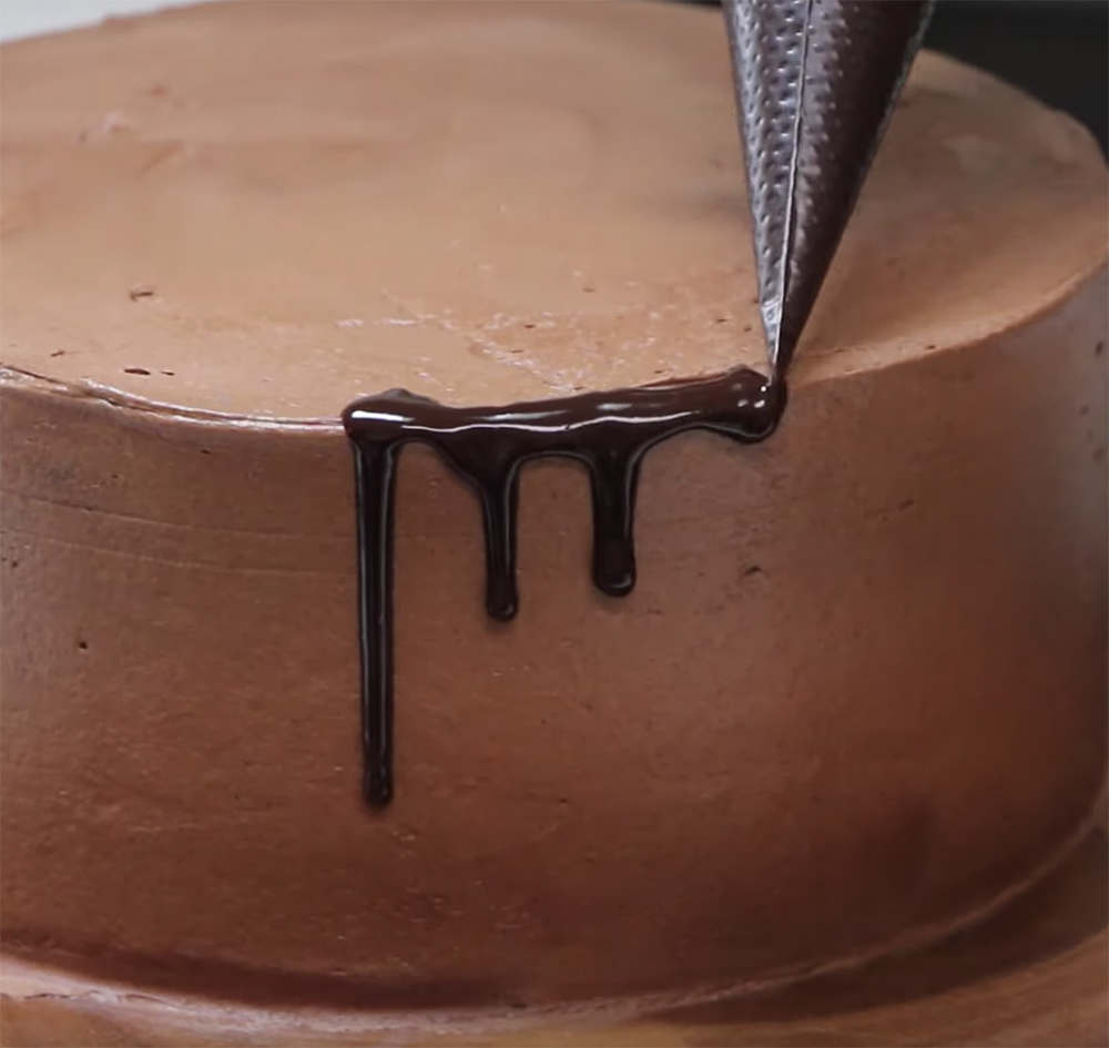 closeup of chocolate drip on chocolate cake