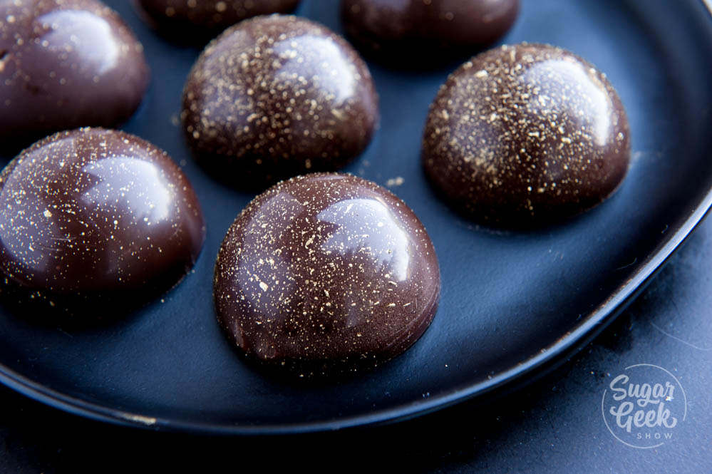chocolate caramel candy with gold splatter