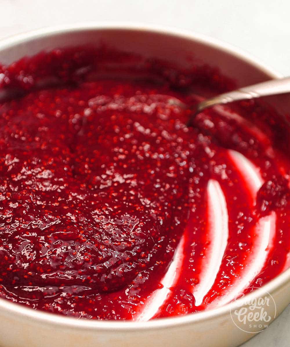 cooling raspberry filling in a cake pan