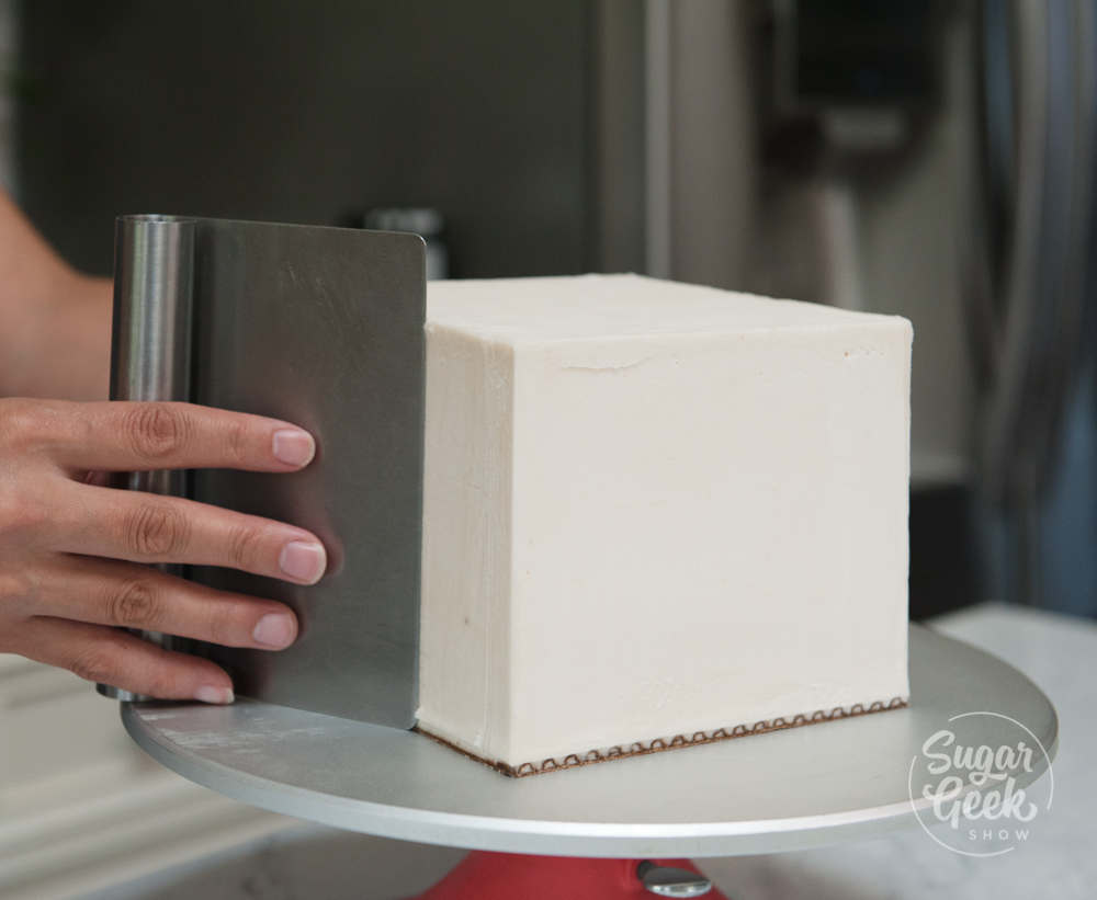 Clean up the edges of your square cake with a warm spatula