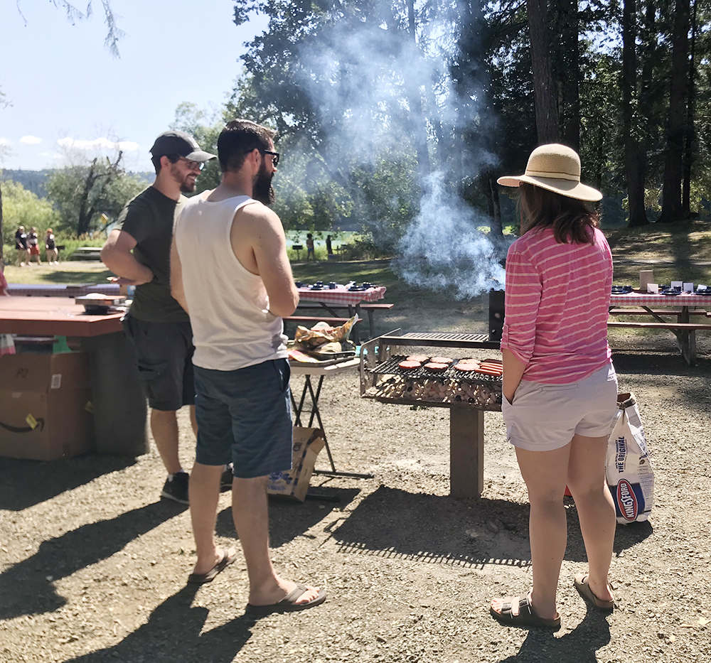 grilling burgers at co-ed baby shower at the lake