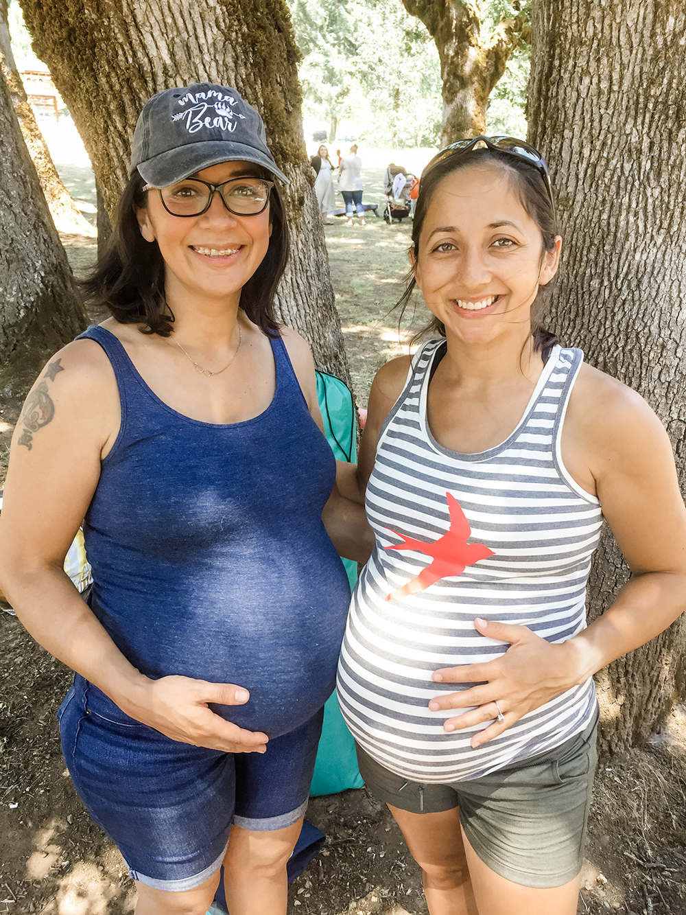 sisters with pregnant bellies