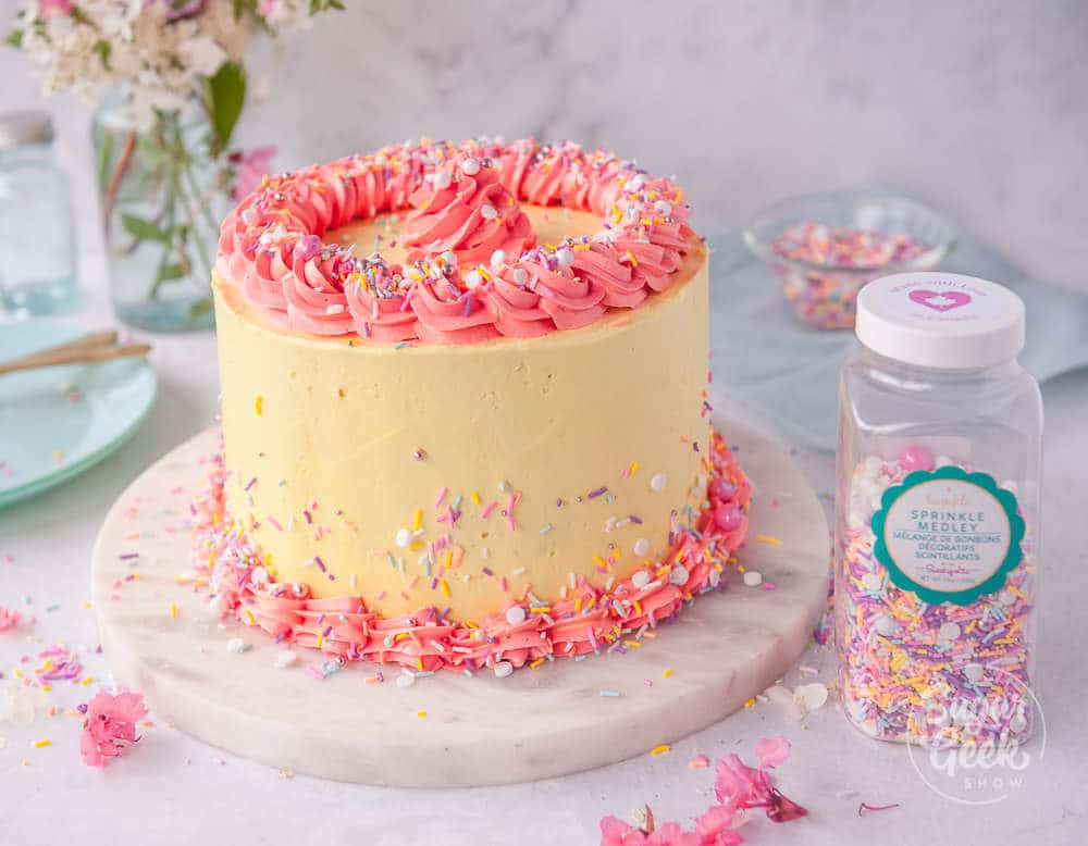 strawberry cake frosted with lemon buttercream and decorated with sweetapolita twinkle medley sprinkles