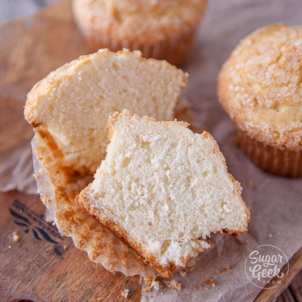 soft and fluffy muffin cut open on wrapper to show texture
