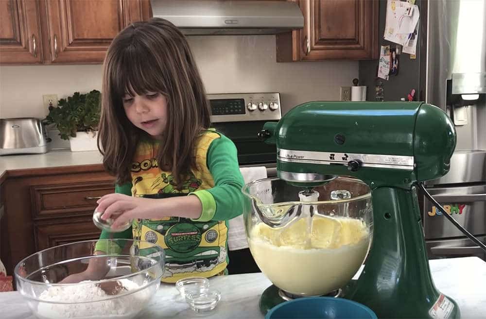 4 year old girl baking sugar cookies