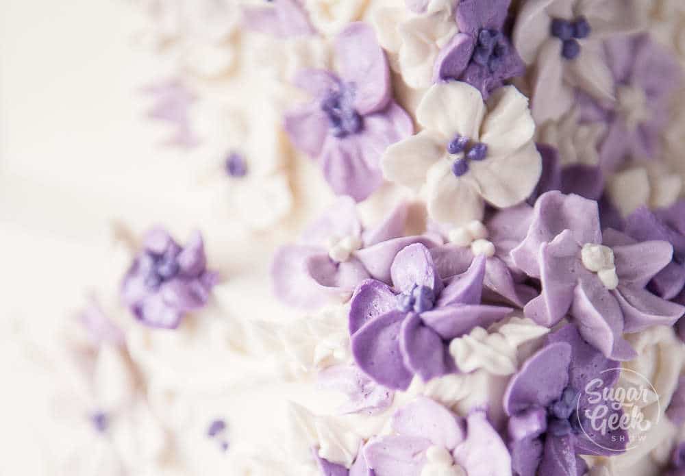 close up of purple buttercream flowers