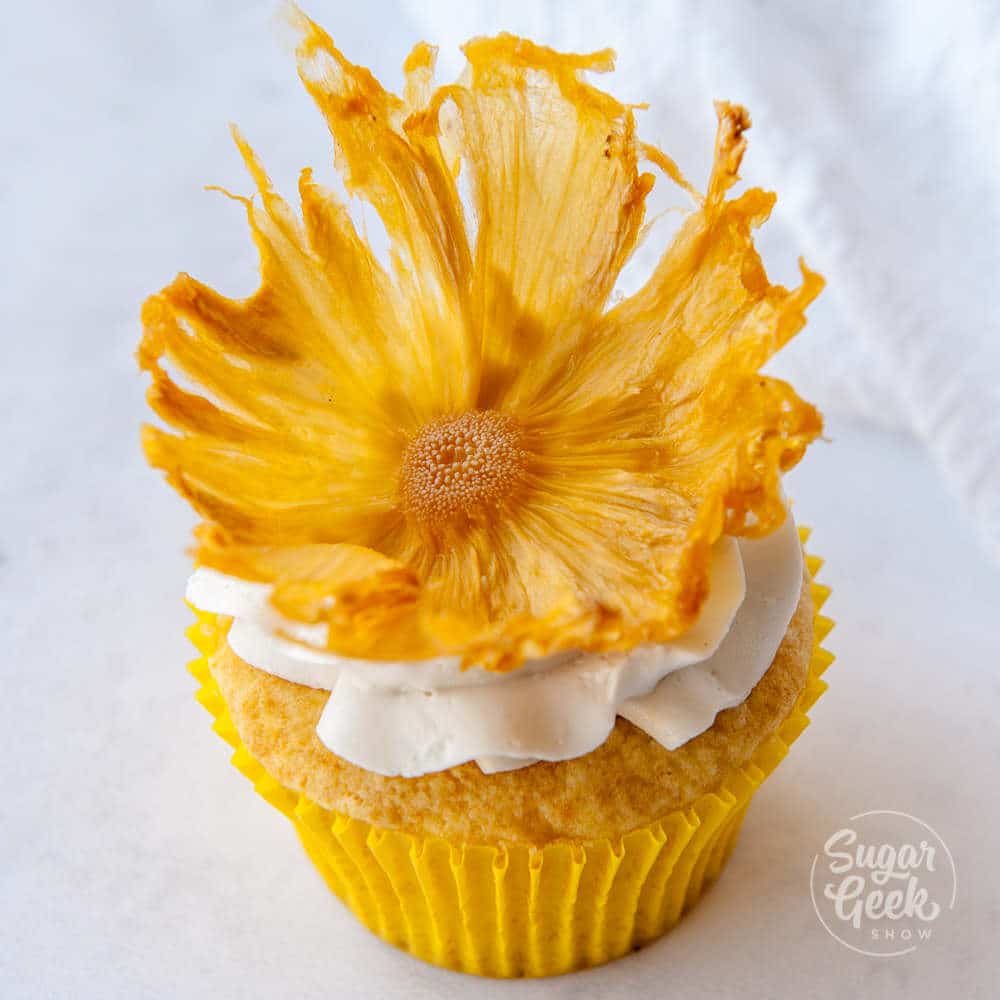 dried pineapple flower on vanilla cupcake