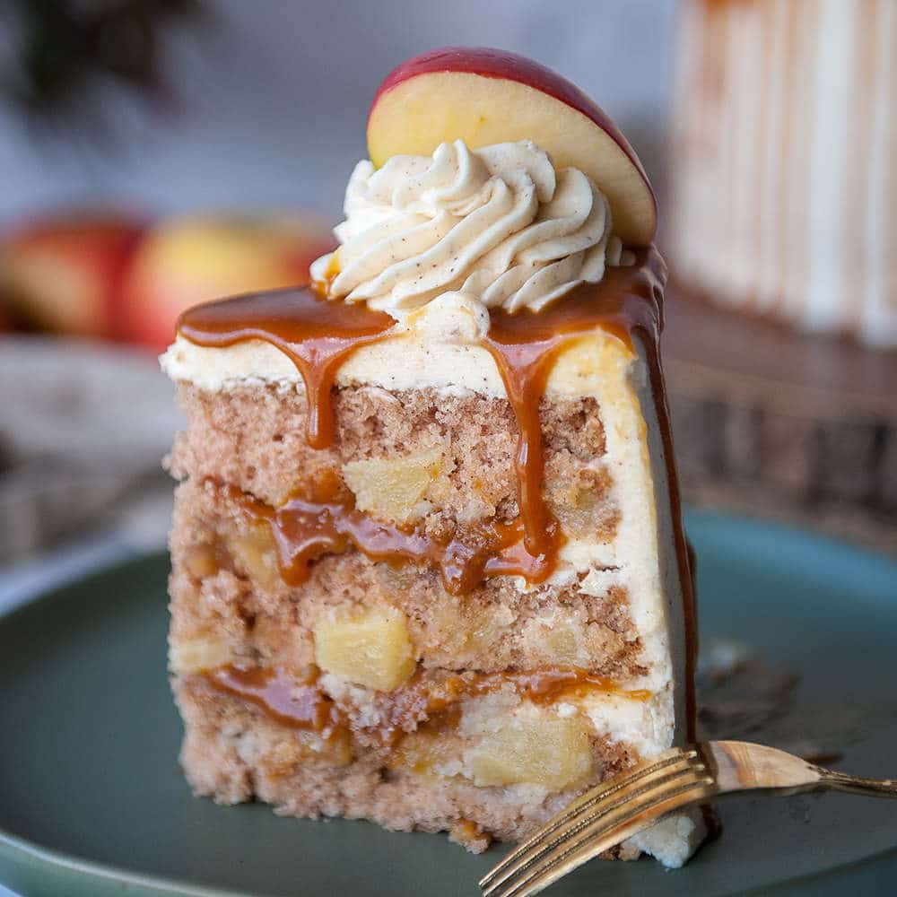 closeup of fresh apple cake recipe with brown butter buttercream on grey plate