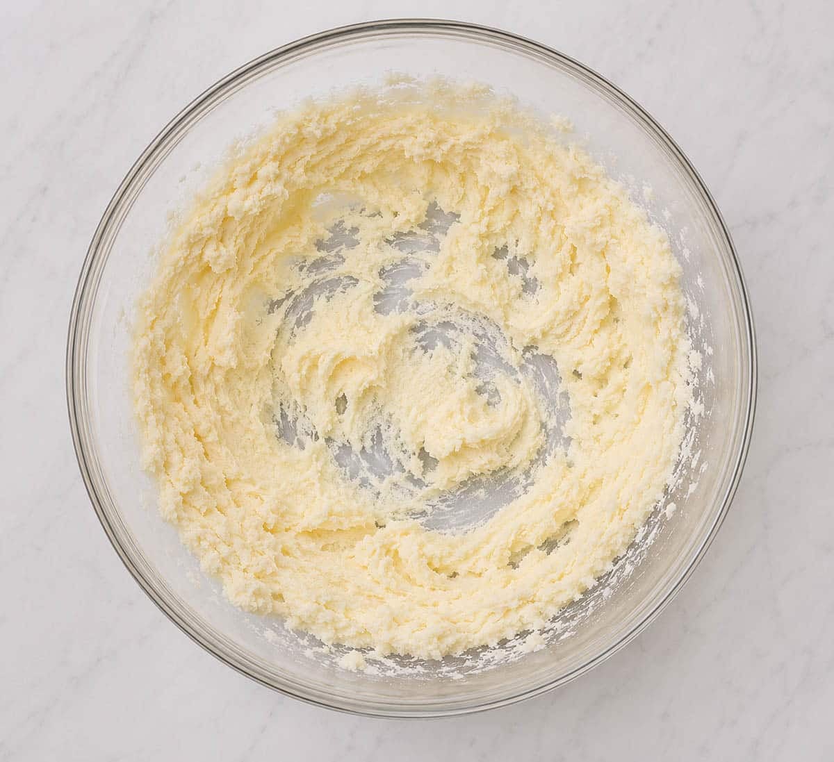 Creamed butter and sugar together in a glass bowl.