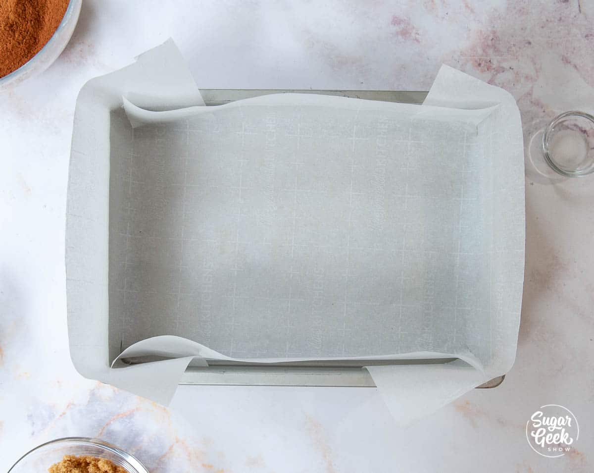 overhead shot of 10"x13" cake pan lined with parchment paper