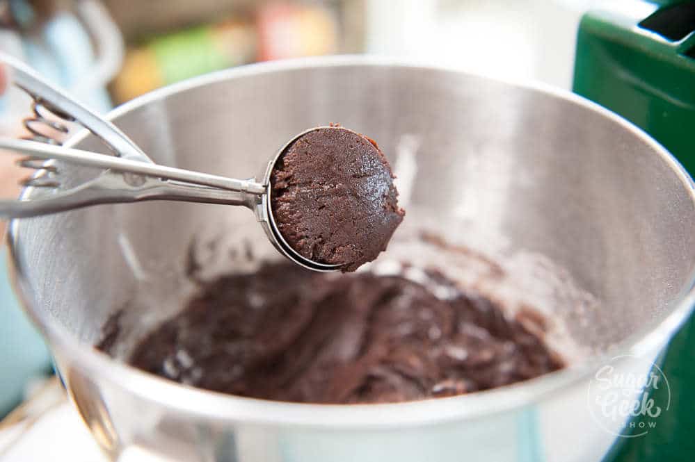 closeup of cookie scoop with chocolate cookie dough