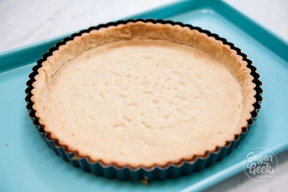 pate sucre in tart pan after blind baking