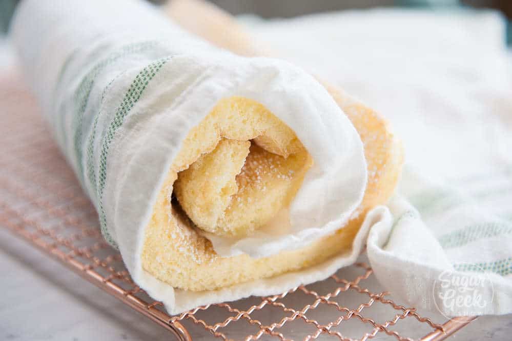 roll up the sponge with a tea towel while it's still warm to prevent cracking