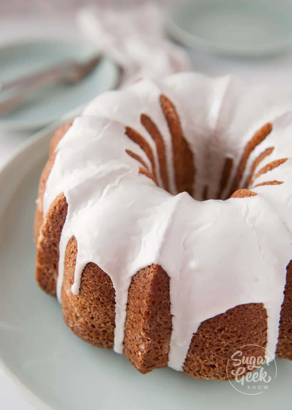 Vanilla bundt cake with blackberry swirls and vanilla glaze