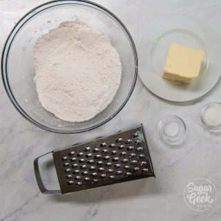 ingredients of flour, butter and a cheese grater
