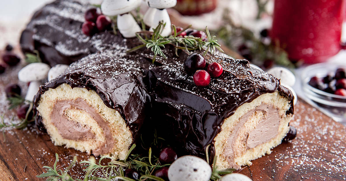 A Buche de Noel cake is a light and airy sponge cake filled with chocolate ...