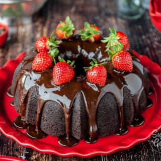 chocolate bundt cake with fresh strawberries