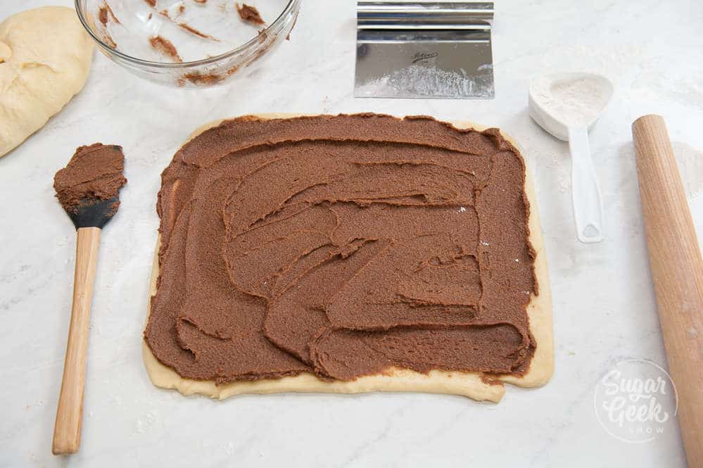 spread the cinnamon roll filling out over the dough