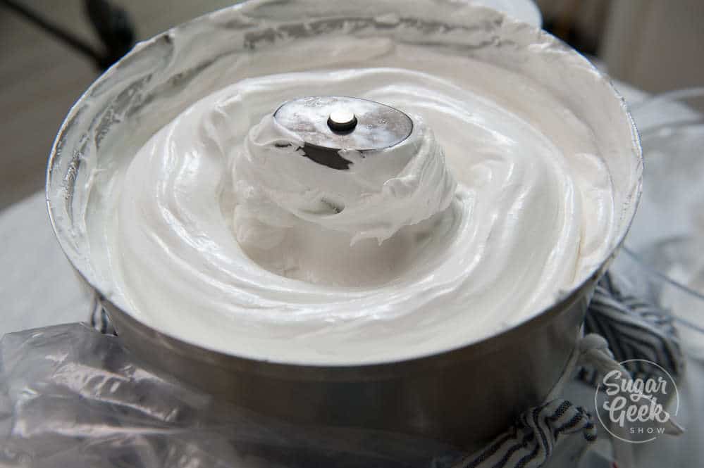 Close up of iItalian meringue buttercream in a metal mixer.