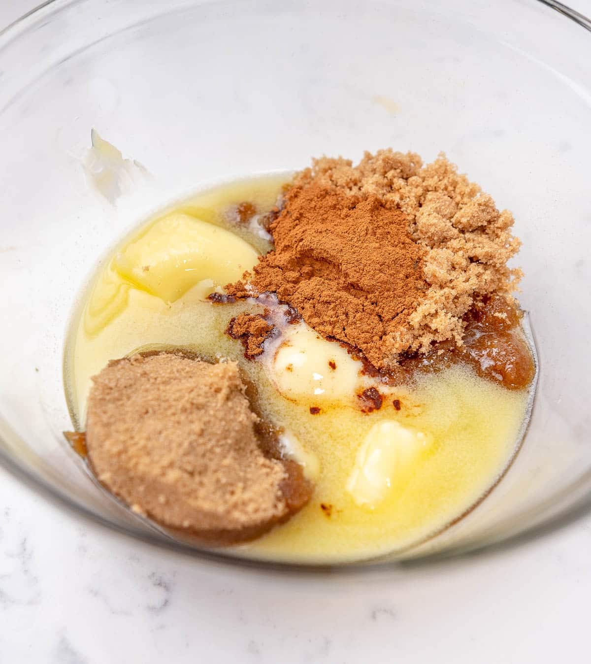 brown sugar, cinnamon, and butter in a glass bowl for the cinnamon roll filling
