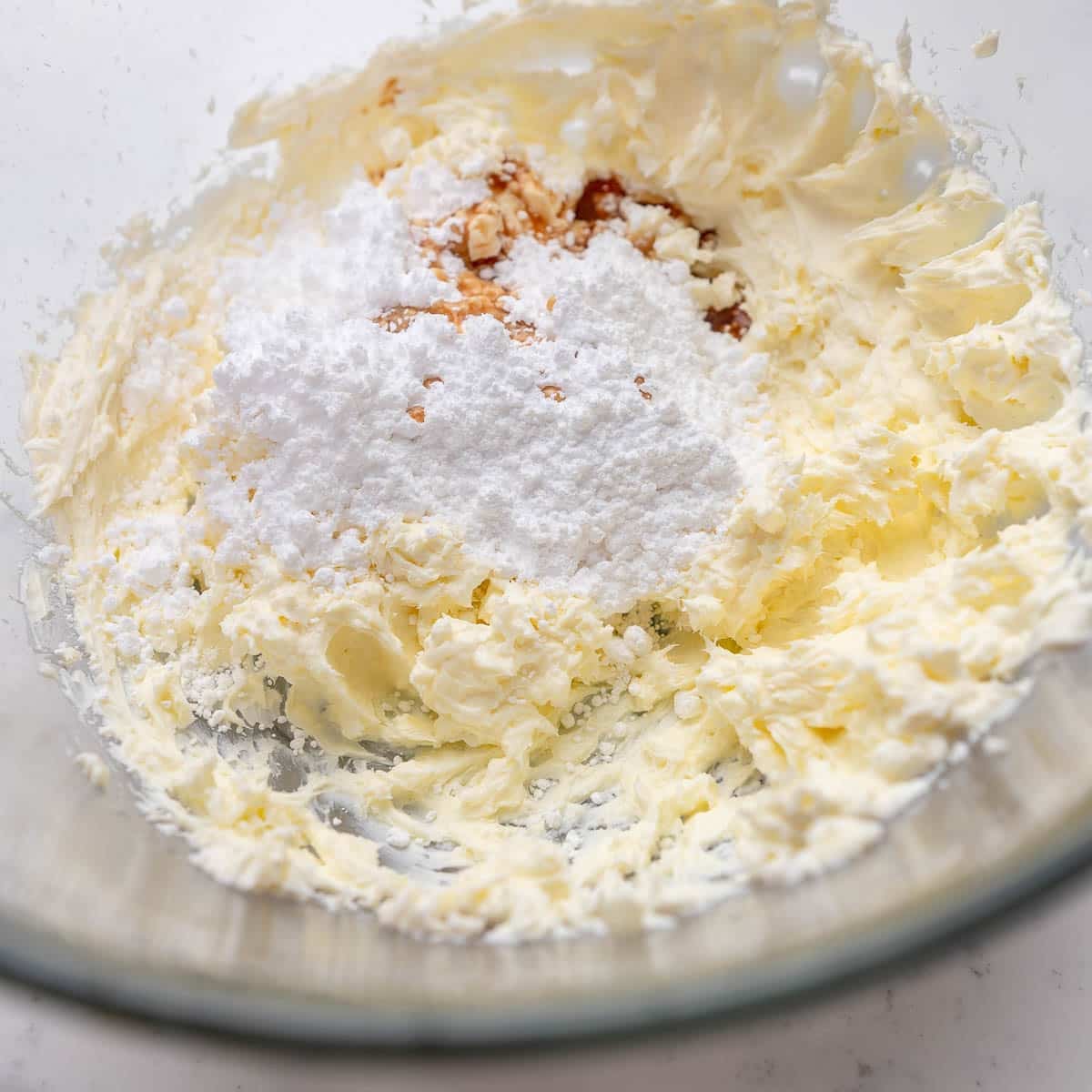 powdered sugar added to whipped cream cheese and butter for cream cheese frosting