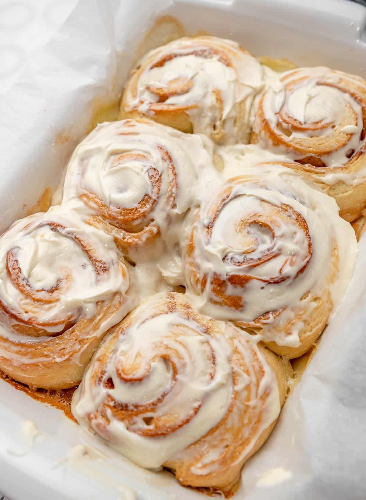 cinnamon rolls slathered in cream cheese frosting