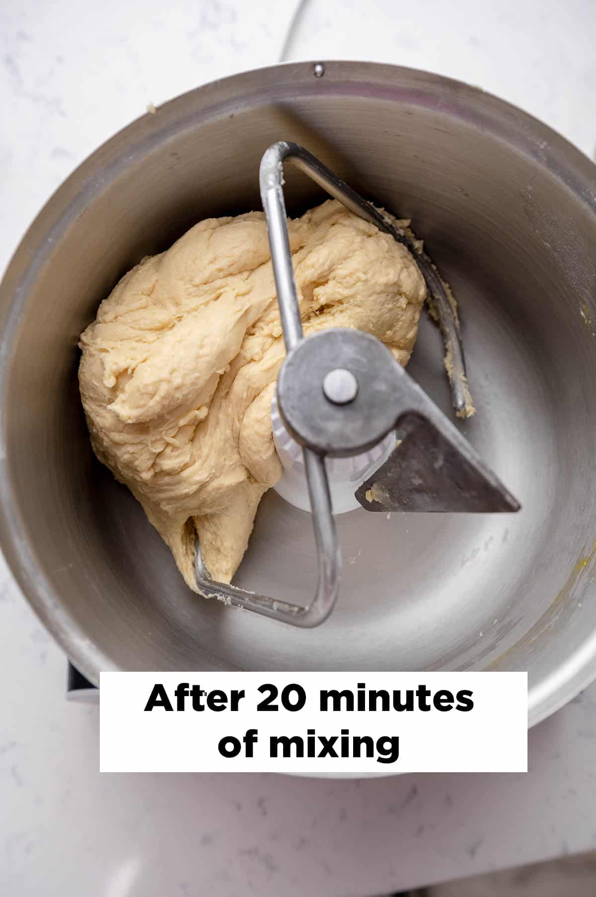 shot of cinnamon roll dough in a mixing bowl shot from above