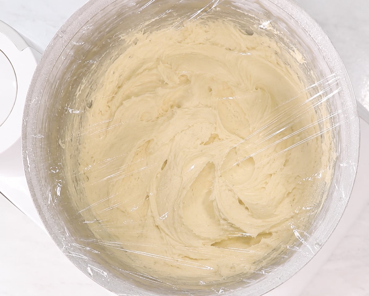 Lofthouse cookie dough in a bowl covered in plastic wrap.