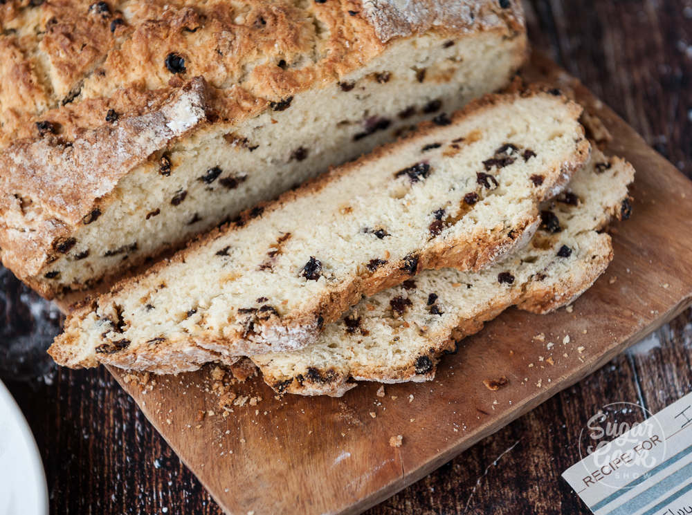 sliced irish soda bread on wooden cutting board