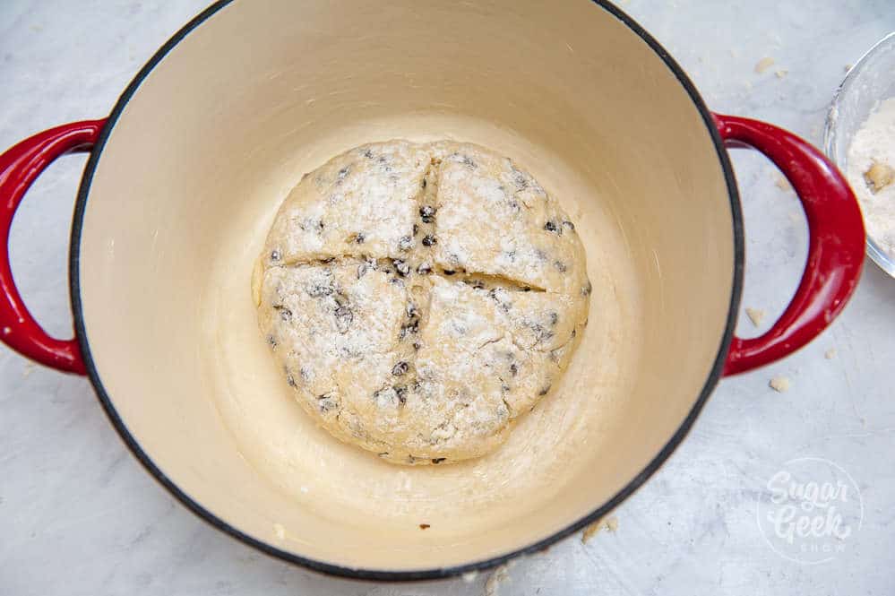 irish soda bread dough in a dutch oven
