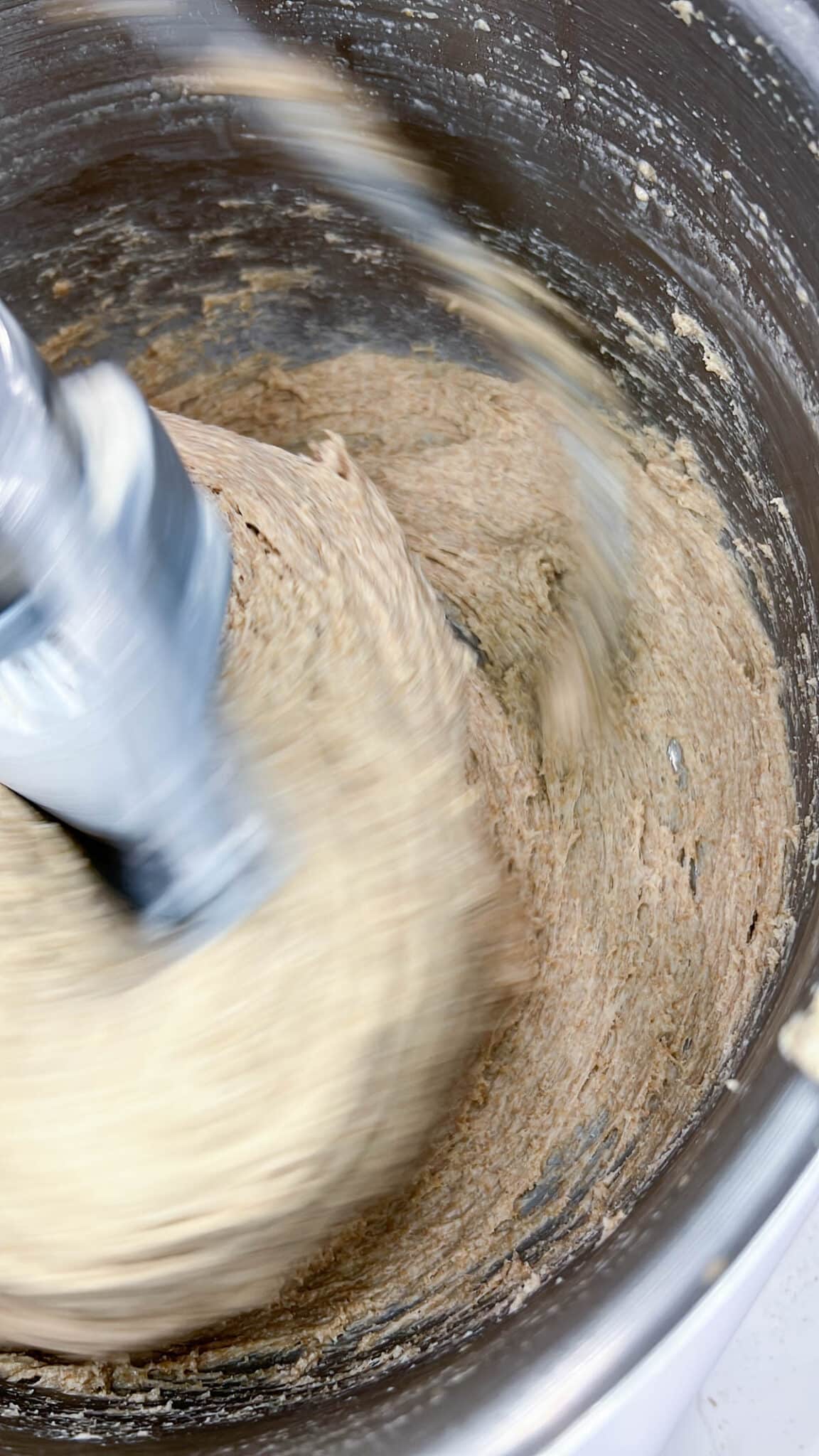 Close up of whole wheat dough in a mixer