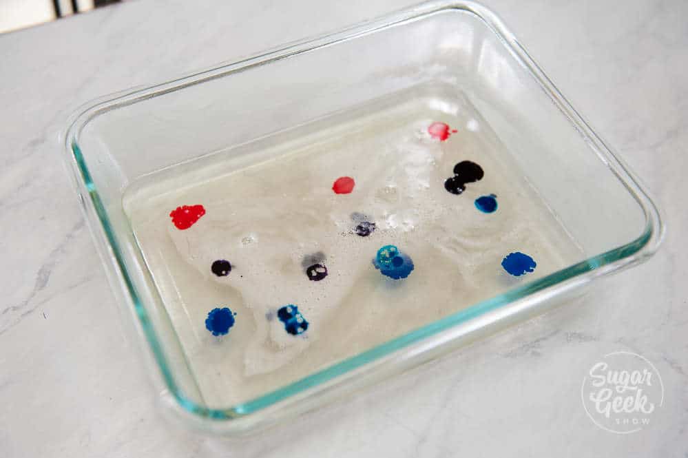 kokakutou in a small container with drops of food coloring