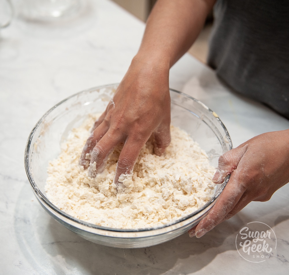 mixing biscuit ingredients with hand