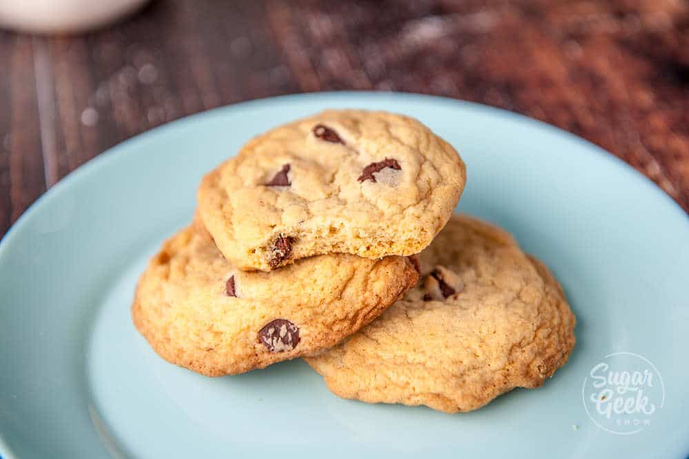 chocolate chip cookies made with melted butter on a blue plate on a wooden background
