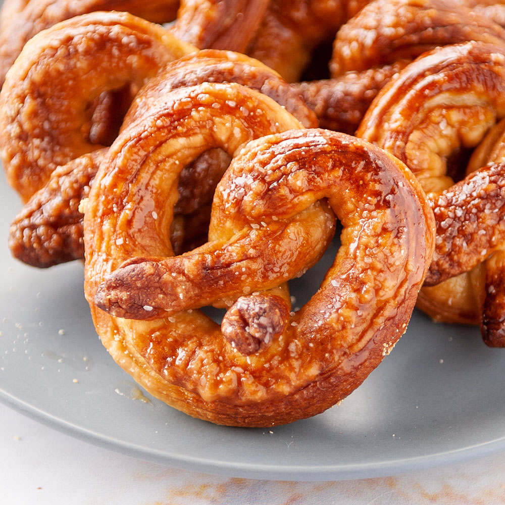 homemade soft pretzels on a light blue plate