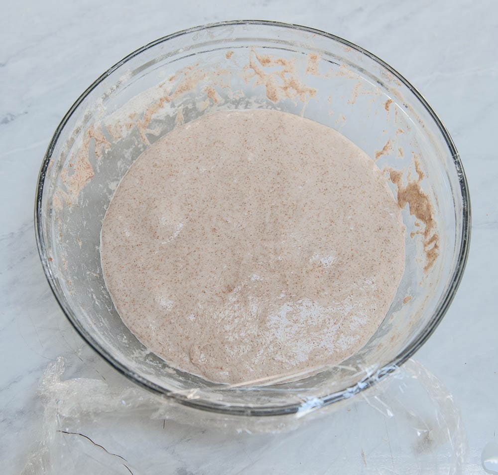 relaxed sourdough in a clear bowl