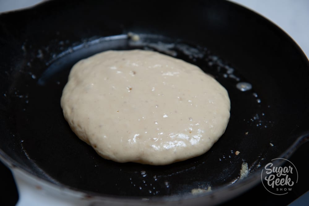 sourdough pancake batter in a cast iron skillet