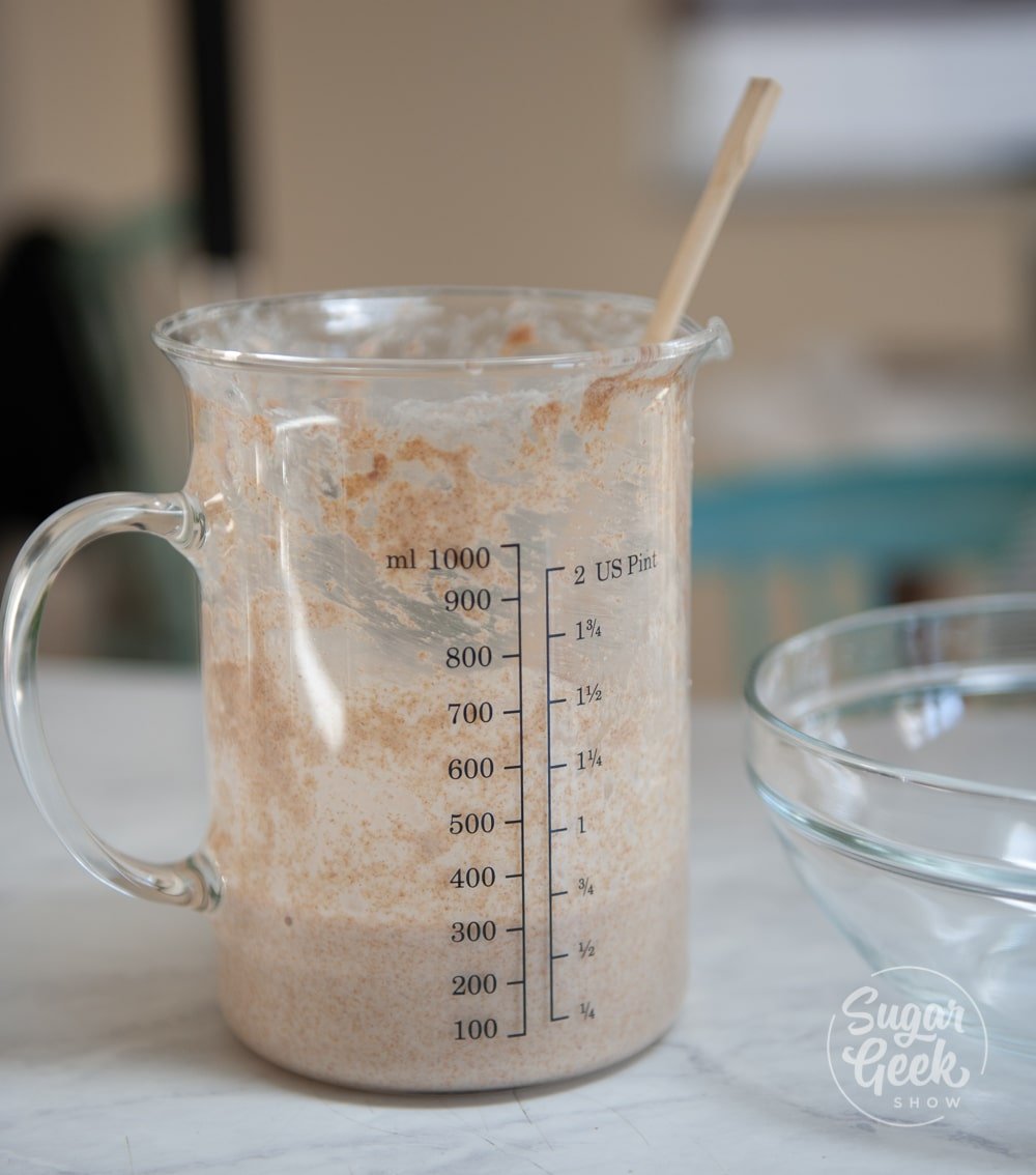sourdough starter in clear measuring cup