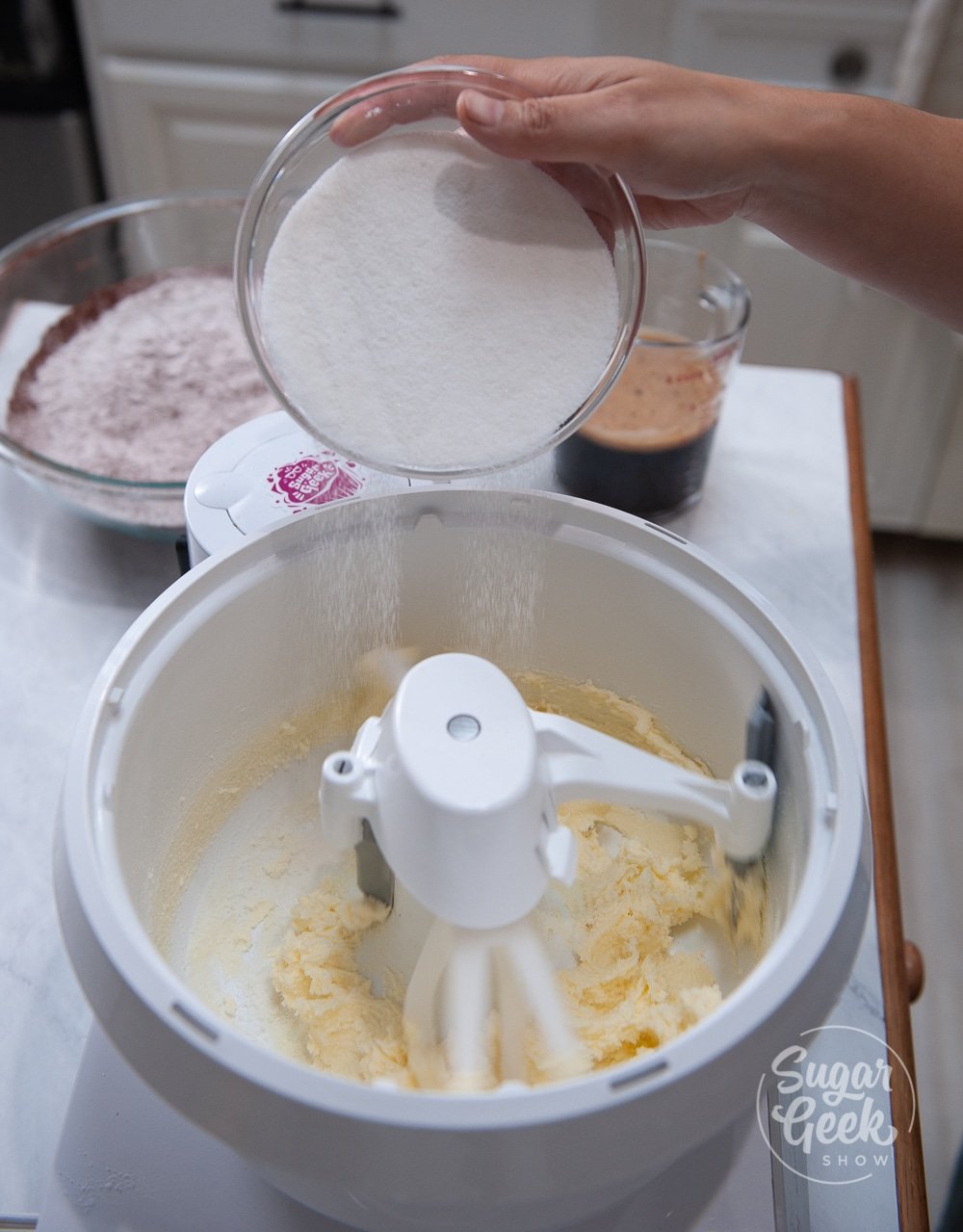 adding sugar to creamed butter