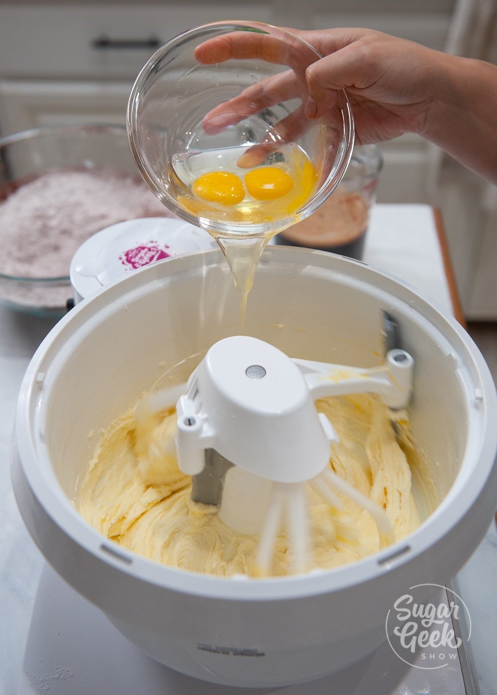 adding egg to butter and sugar mixture