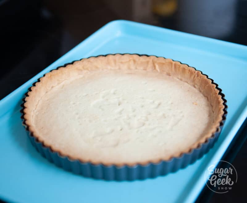 tart pan on blue sheet pan