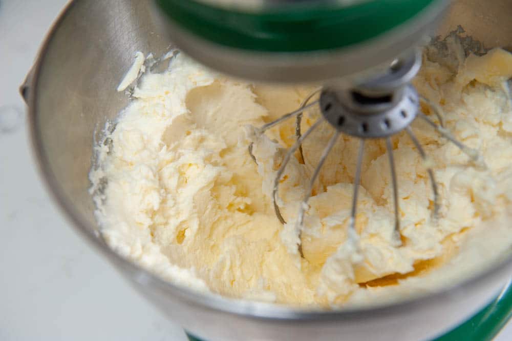 whipping butter into eggs and powdered sugar
