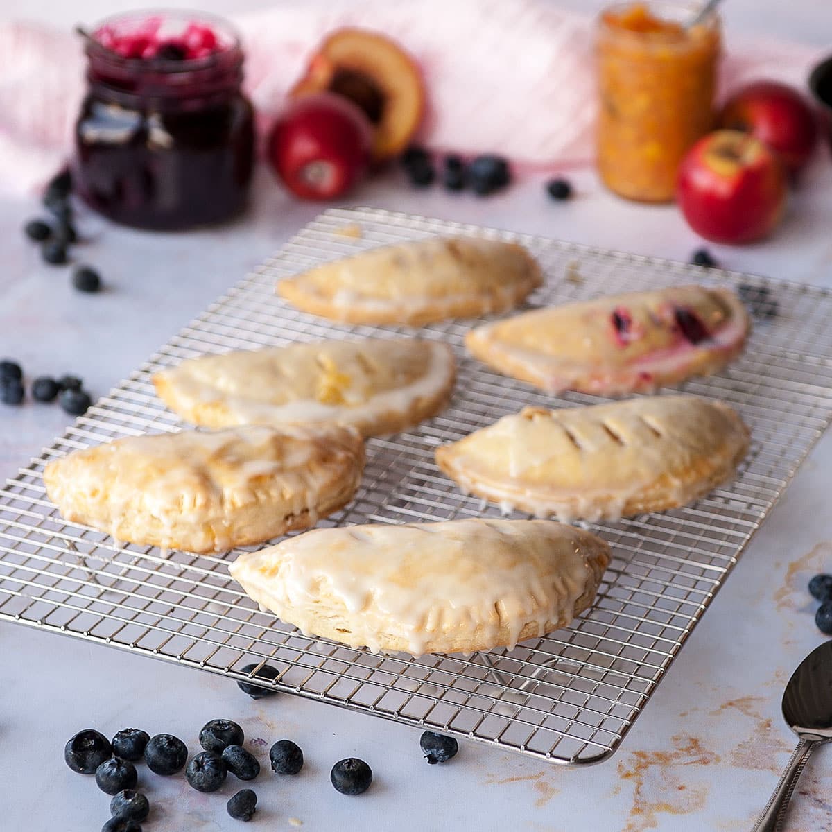 close up of six hand pies on a cooling rack