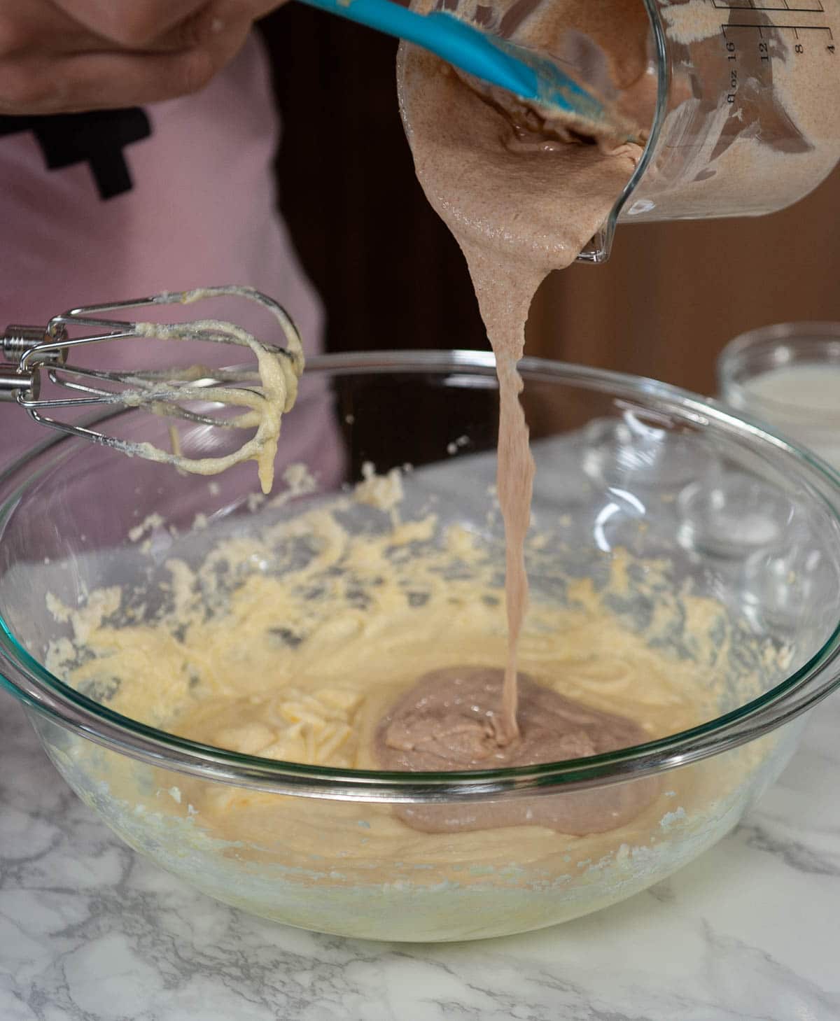Mixing sourdough discard into donut batter.